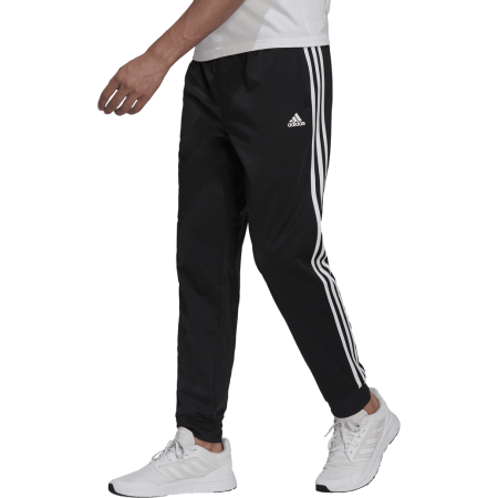 Adidas vyriškos kelnės Essentials 3-Stripes Tricot Tapered Pants H46105 juodos su baltomis juostelėmis sportui ir laisvalaikiui
