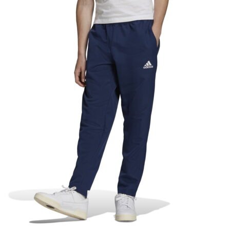 Adidas Entrada 22 M Pants HB5329 – mėlynos vyriškos sportinės kelnės su siaurėjančiu kirpimu ir užtrauktukais klešnių apačioje.