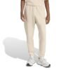 Šviesiai kreminės vyriškos Adidas Future Icons sportinės kelnės su siaurėjančiomis klešnėmis ir mažu logotipu, modelis KD7641.